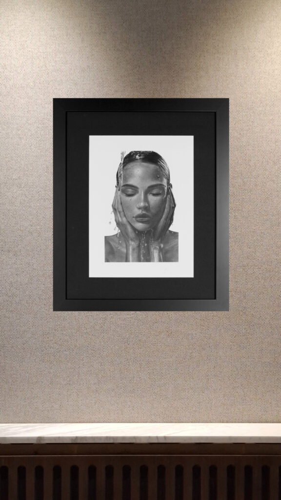 Charcoal and graphite portrait of woman with closed eyes in calm, minimalist presentation