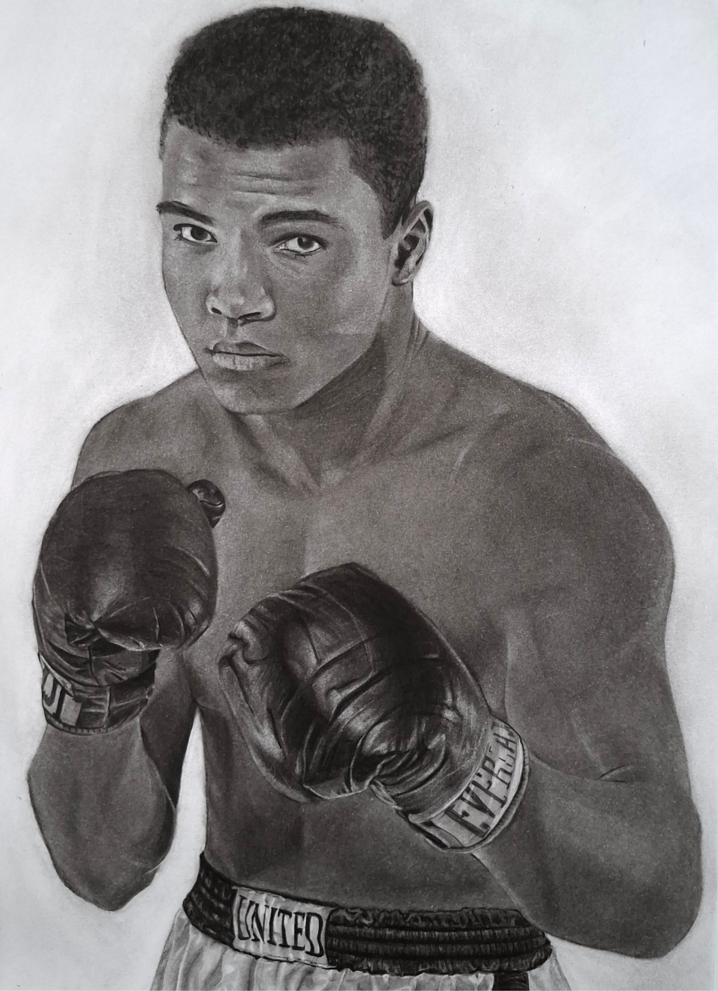 Charcoal portrait drawing titled The Greatest Muhammad Ali depicting a legendary boxer in a classic fighting stance