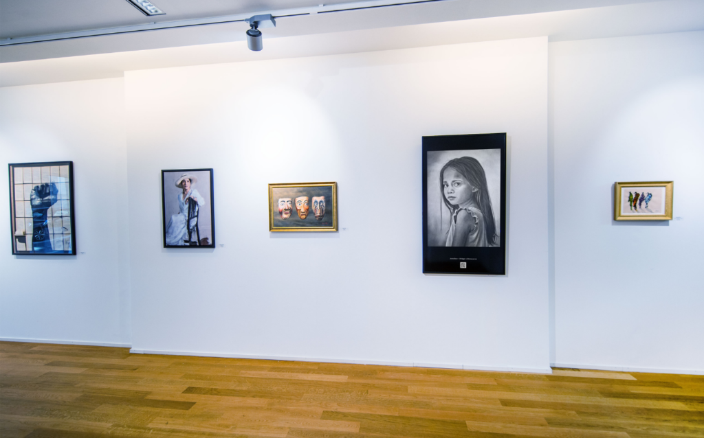 Contemporary charcoal artworks by Janis Bär presented in an international digital exhibition and online gallery showcase.